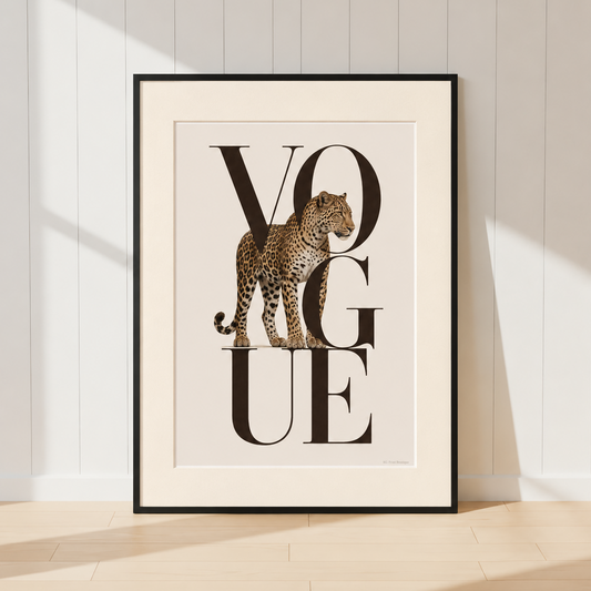 Luxury Vogue leopard wall art featuring bold black typography and a realistic leopard illustration in warm neutral tones, displayed in a black frame with a warm ivory mount.