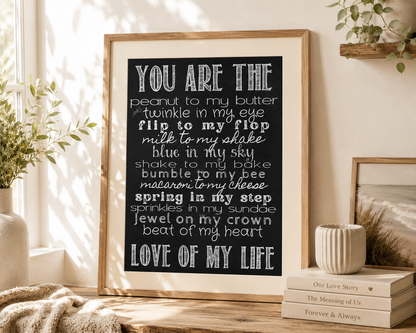 Black and white love quote print designed for couples, weddings, anniversaries and Valentine's Day, styled in a natural oak frame with ivory mount.