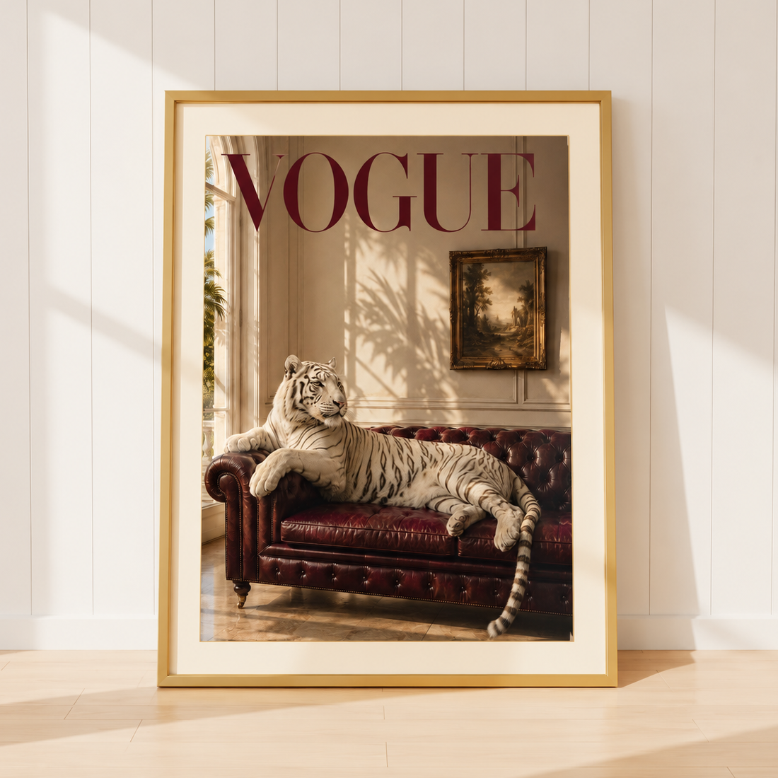 Luxury Vogue-inspired white tiger wall art featuring a majestic white tiger reclining on a burgundy Chesterfield sofa within elegant interiors.
