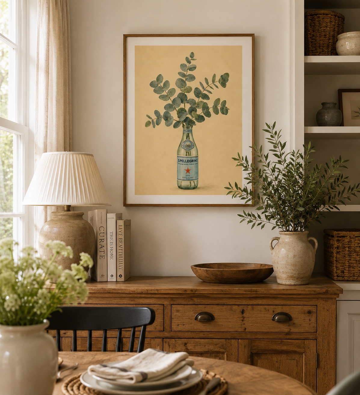 Botanical kitchen wall art featuring eucalyptus stems inside a San Pellegrino bottle with sage green and cream tones.