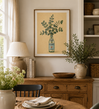 Botanical kitchen wall art featuring eucalyptus stems inside a San Pellegrino bottle with sage green and cream tones.