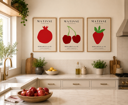 Modern kitchen gallery wall set showcasing pomegranate, cherry and strawberry artwork inspired by Henri Matisse paper cut-out designs.