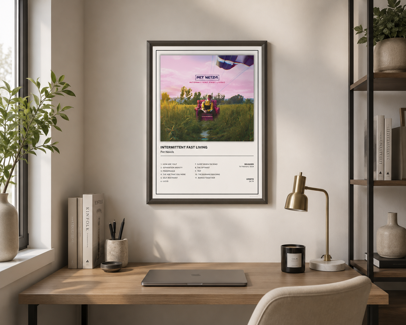 Minimalist Pet Needs Intermittent Fast Living music poster displayed in a stylish neutral living room.