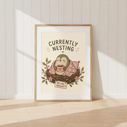 Currently Nesting bird print featuring cozy bird wrapped in blanket with warm drink
