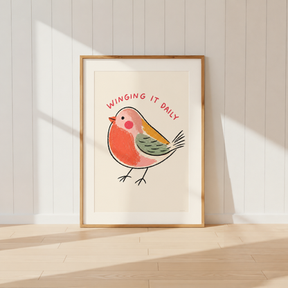 Funny robin bird wall art with Winging It Daily quote in light oak frame.
