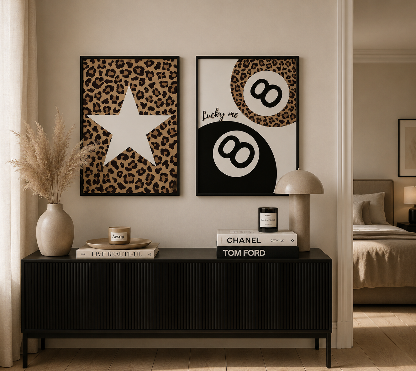 Luxury neutral glam leopard print posters in black frames above a modern console table.