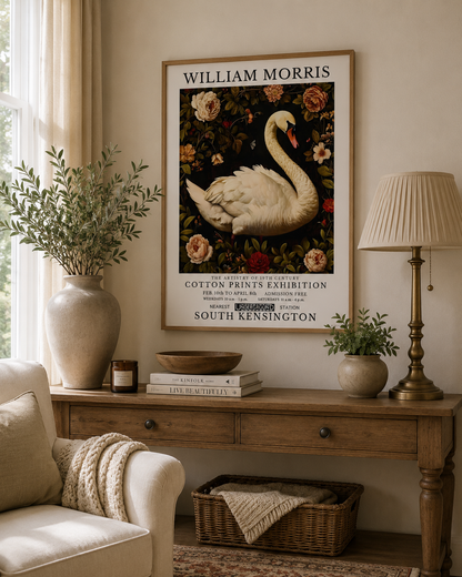 William Morris inspired swan print displayed above a wooden console table in a neutral living room with botanical decor and warm natural lighting.