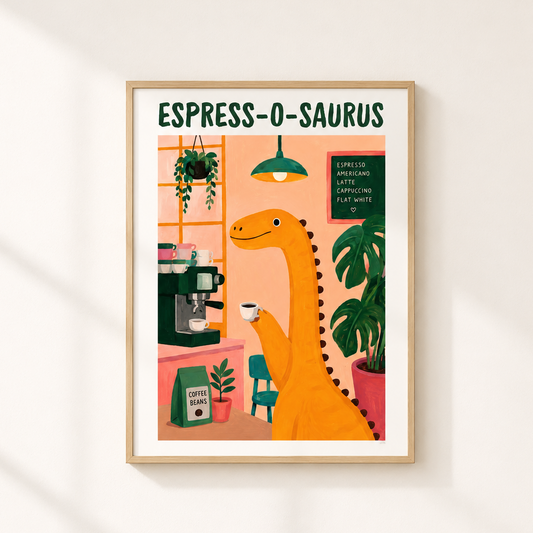 A framed art print featuring a whimsical illustration of an orange dinosaur barista making espresso, titled 'ESPRESS-O-SAURUS', displayed on a warm off-white wall with soft diagonal shadows.