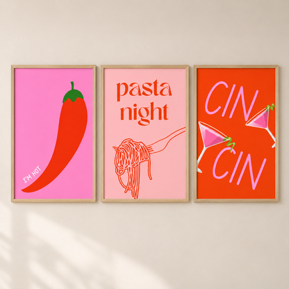 Three framed minimalist art prints hanging on a light beige wall. The left print has a bright pink background with a large red chili pepper and the words 'I'M HOT'.