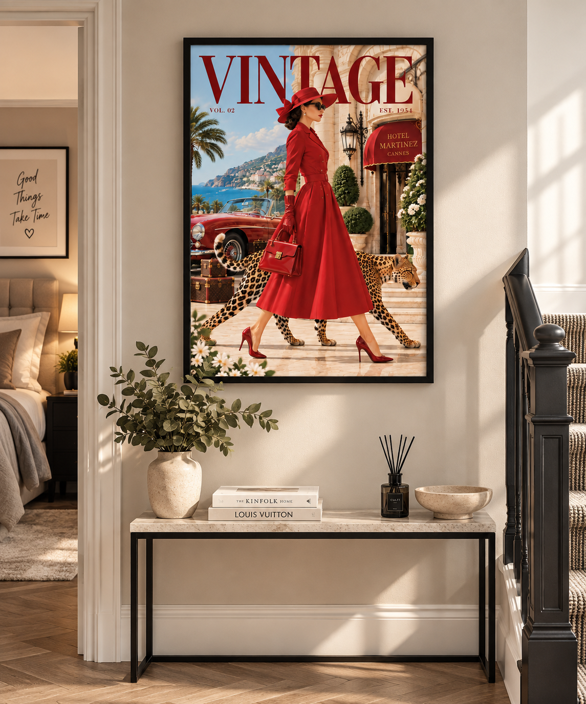 A framed vintage-style poster hanging on a wall above a console table in a styled interior. The poster features a woman in a bright red dress walking beside a cheetah, with large 'VINTAGE' lettering at the top and a retro car in the background.