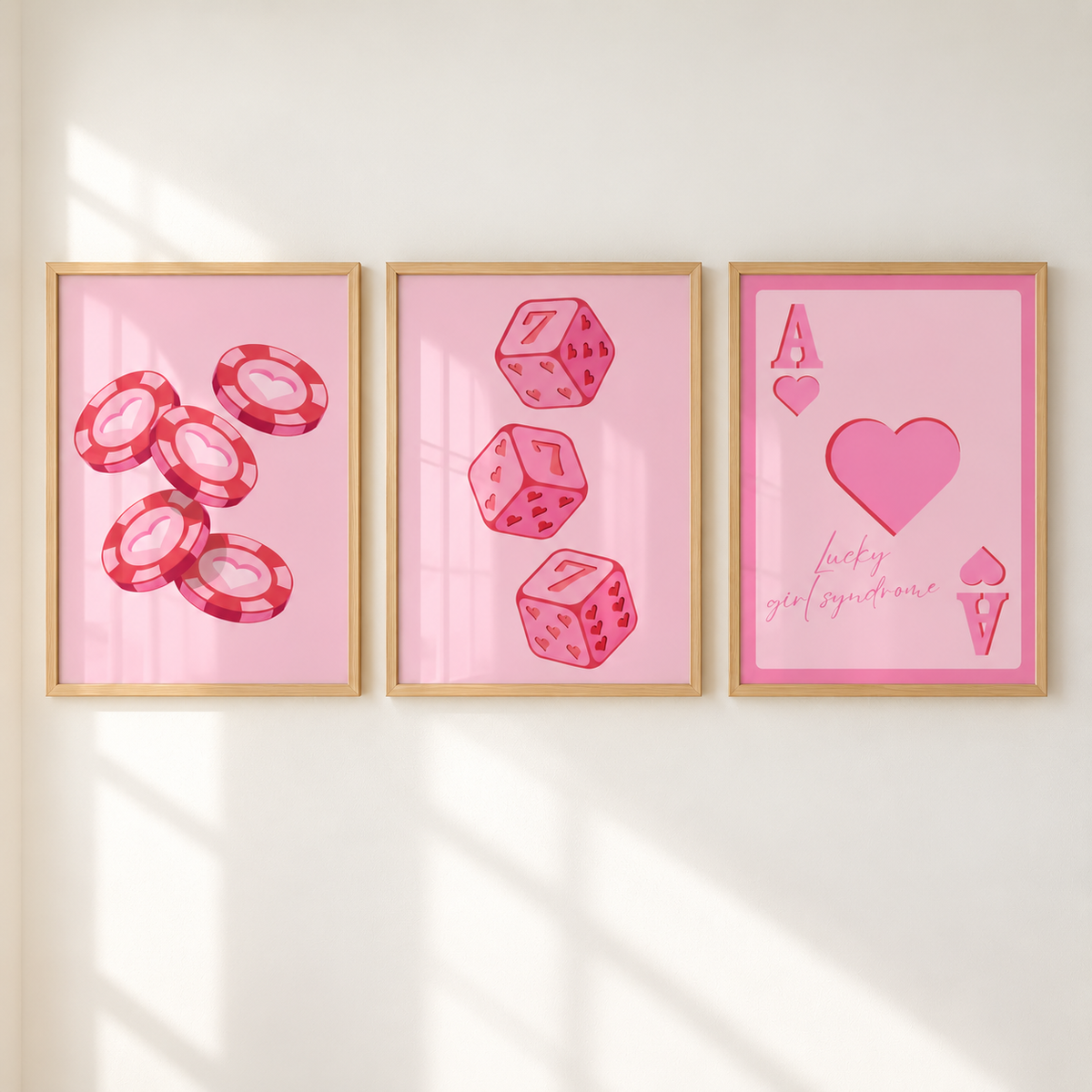 Pink Lucky Girl Syndrome wall art set of 3 with poker chips, lucky 7 dice and ace of hearts prints in light oak frames