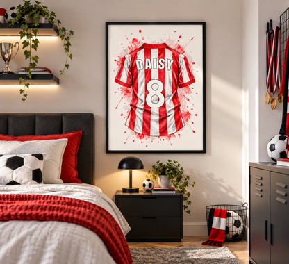 A framed wall art print featuring a red and white striped football jersey with the name DAISY and number 8, displayed above a bed in a styled bedroom.