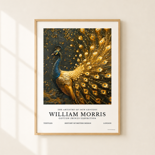 A framed art print of William Morris's 19th-century peacock illustration, displayed on a warm beige wall with soft window shadow overlays. The print features a detailed peacock with a vibrant blue neck and a golden, glittering tail against a dark background, with text at the bottom reading 'WILLIAM MORRIS'.