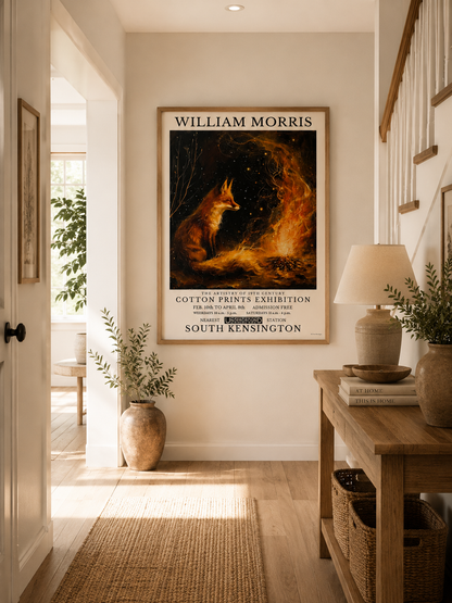 A framed William Morris art print featuring a fox and flames hangs on a beige wall in a bright, modern hallway with a wooden console table, lamp, and plants.