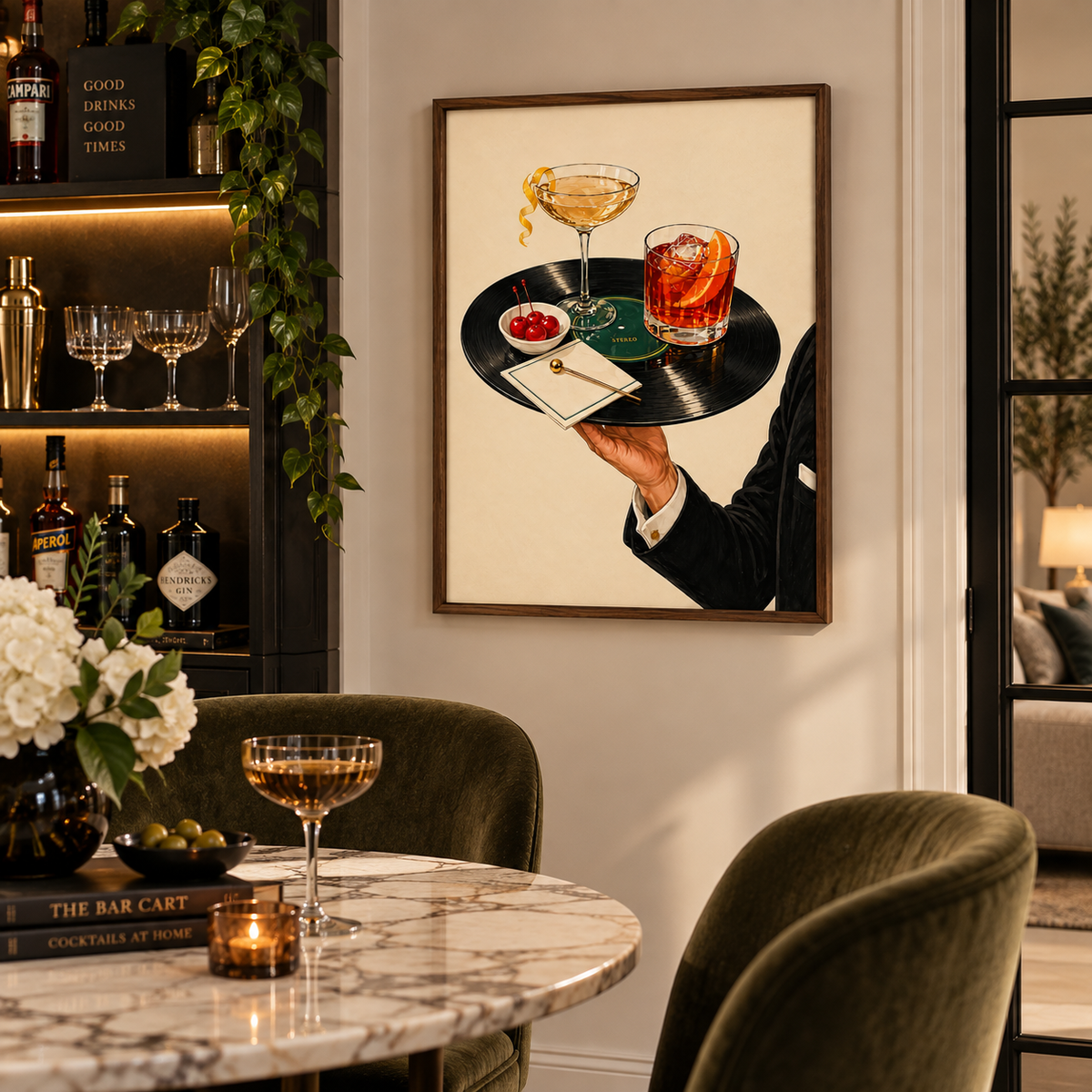 A framed art print depicting a bartender serving a cocktail and a martini on a vinyl record tray, displayed on a wall in a modern, elegantly decorated bar interior.