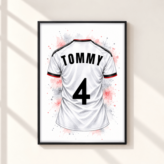 Personalised Fulham inspired football shirt print showing white jersey with TOMMY name and number 4, black red detailing and watercolour splashes in black frame