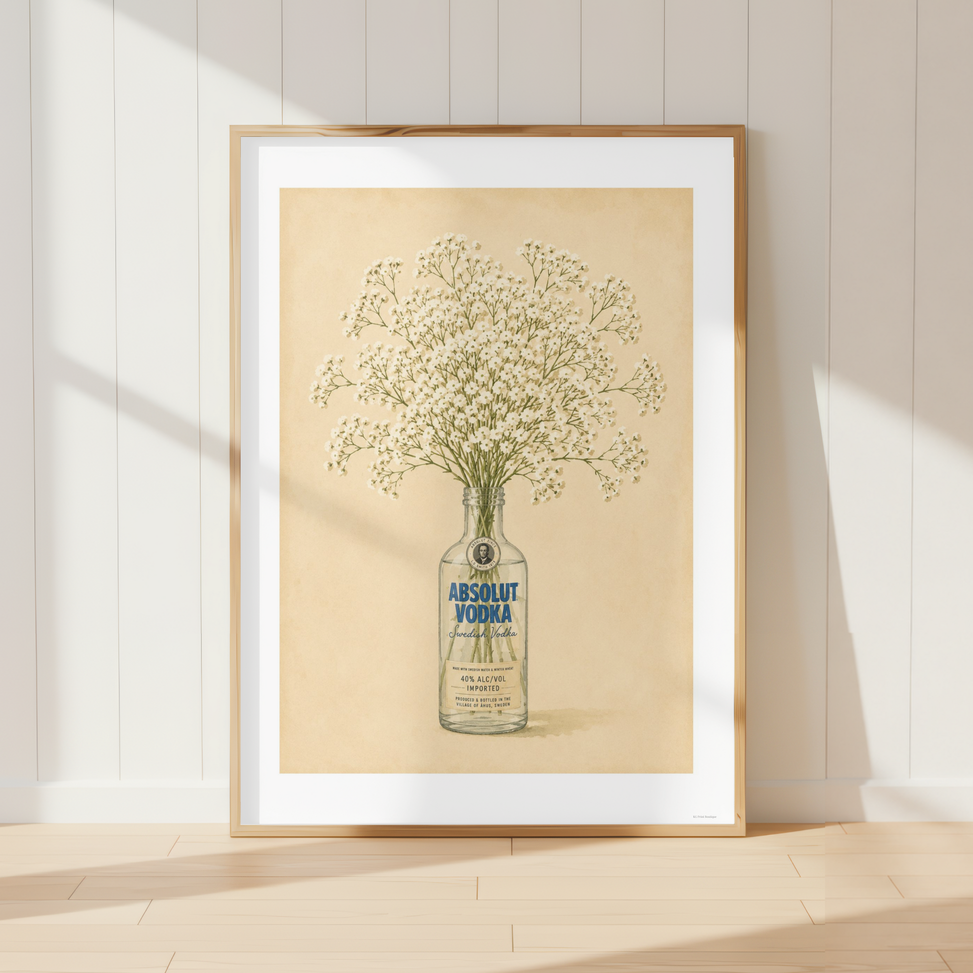 Vintage Absolut Vodka botanical wall art featuring delicate white baby's breath flowers in a farmhouse kitchen.