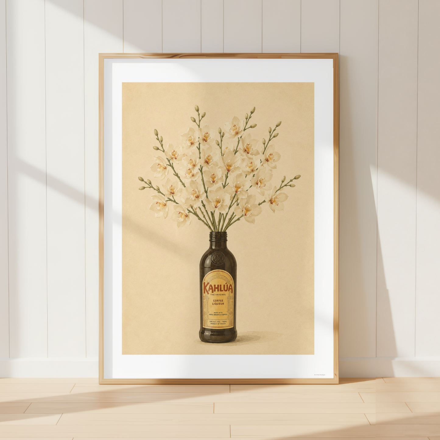 Vintage Kahlua botanical wall art featuring cream orchid flowers arranged in a coffee liqueur bottle.