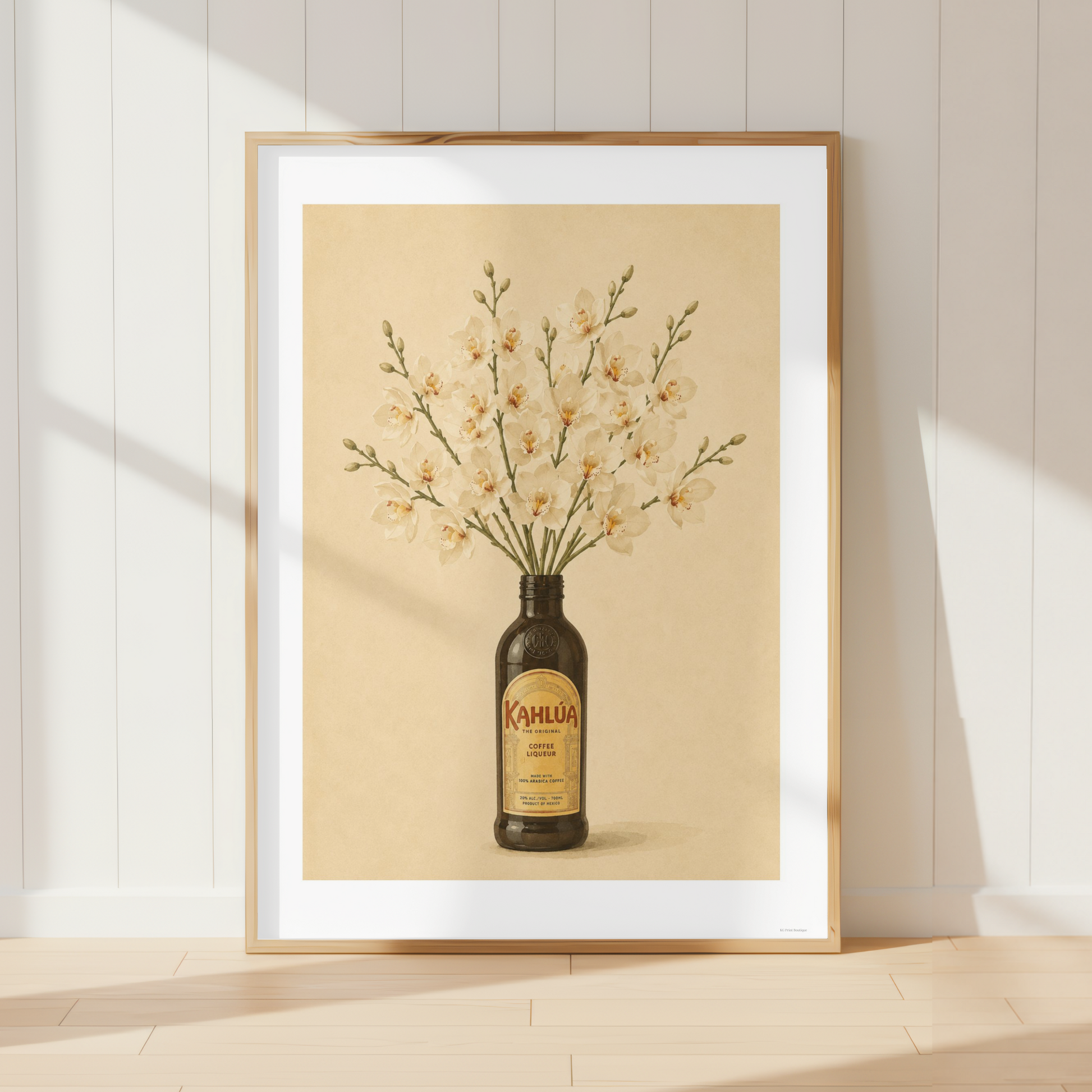 Vintage Kahlua botanical wall art featuring cream orchid flowers arranged in a coffee liqueur bottle.