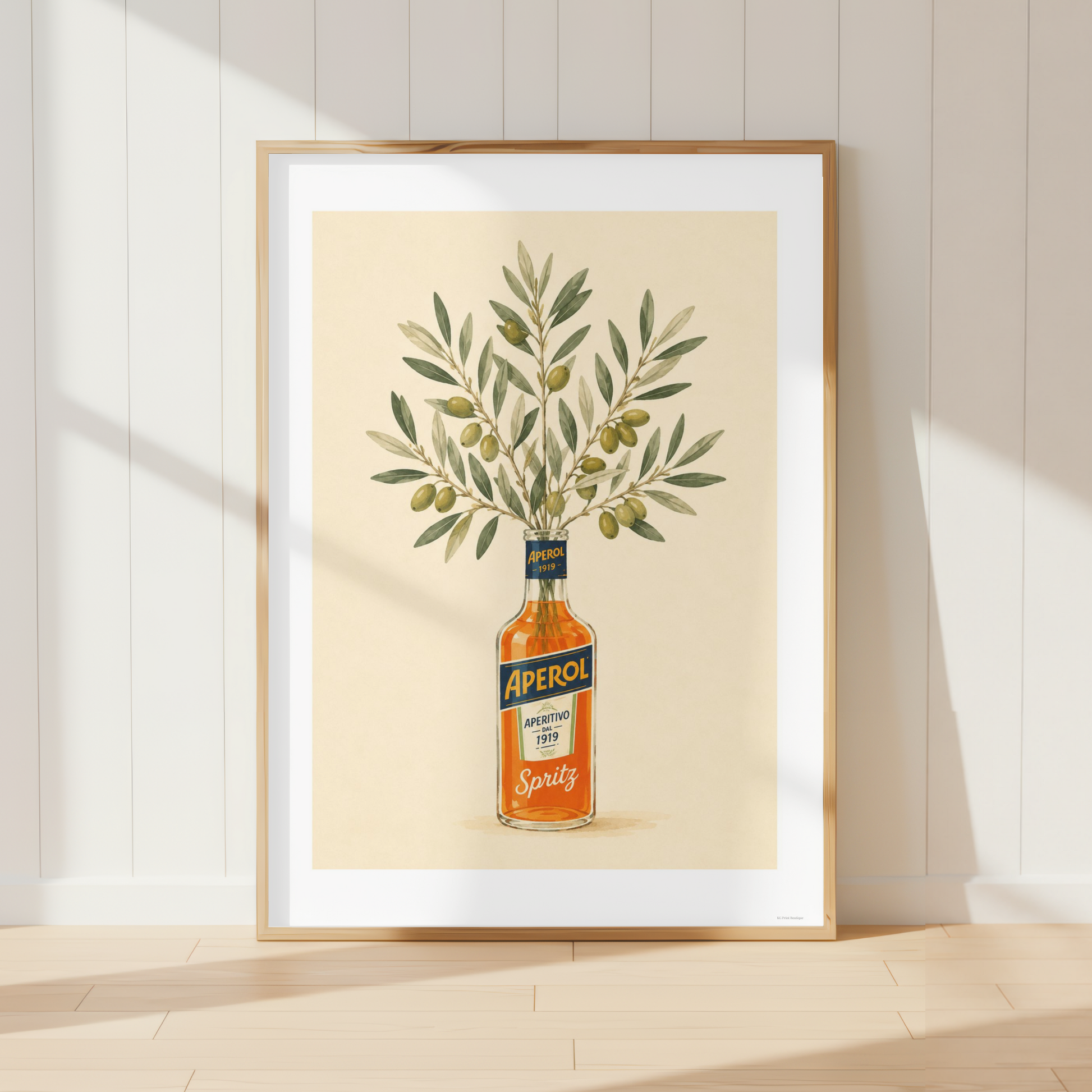 Mediterranean Aperol Spritz wall art featuring olive branches arranged in an Aperol bottle. Italian-inspired botanical print perfect for farmhouse kitchens and rustic dining rooms.