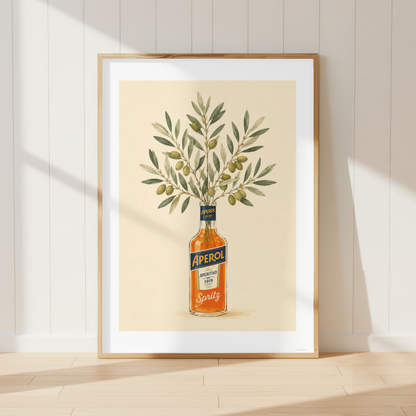 Mediterranean Aperol Spritz wall art featuring olive branches arranged in an Aperol bottle. Italian-inspired botanical print perfect for farmhouse kitchens and rustic dining rooms.