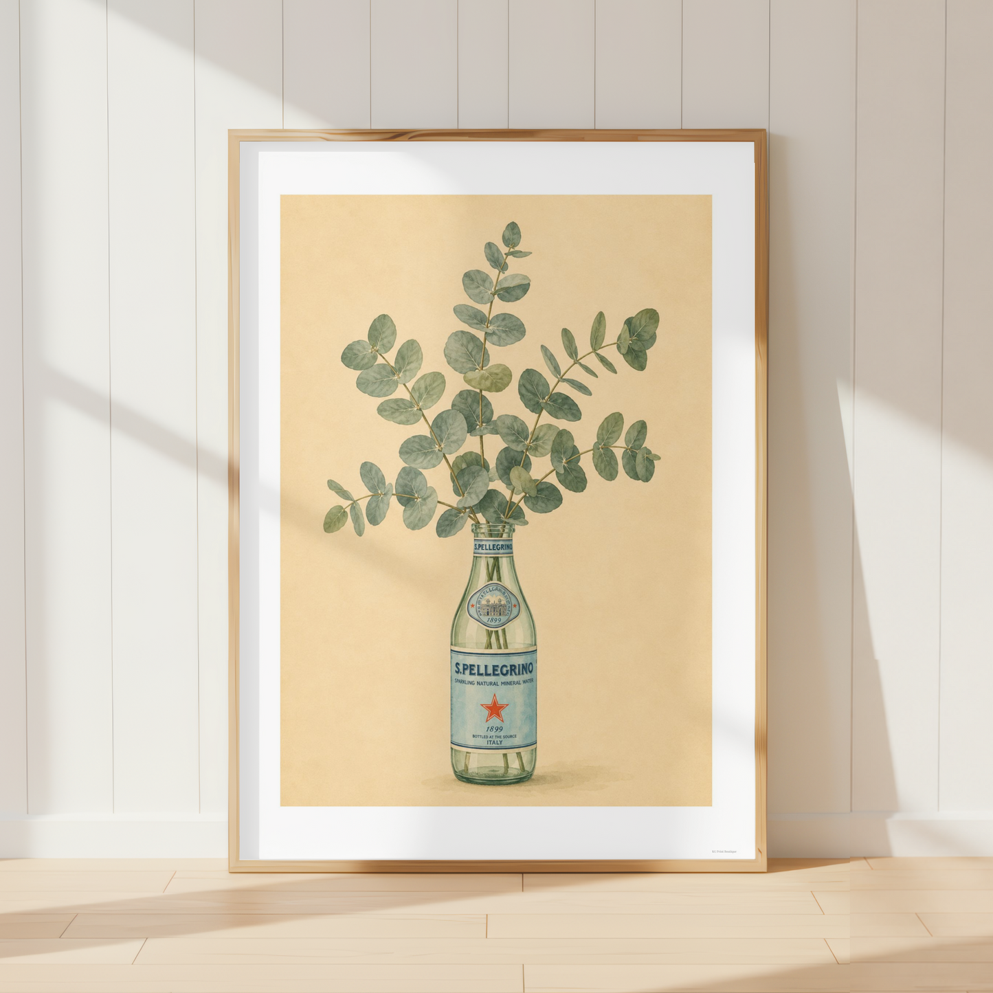 Vintage San Pellegrino eucalyptus wall art displayed in a farmhouse dining room with neutral decor and natural wood furniture.