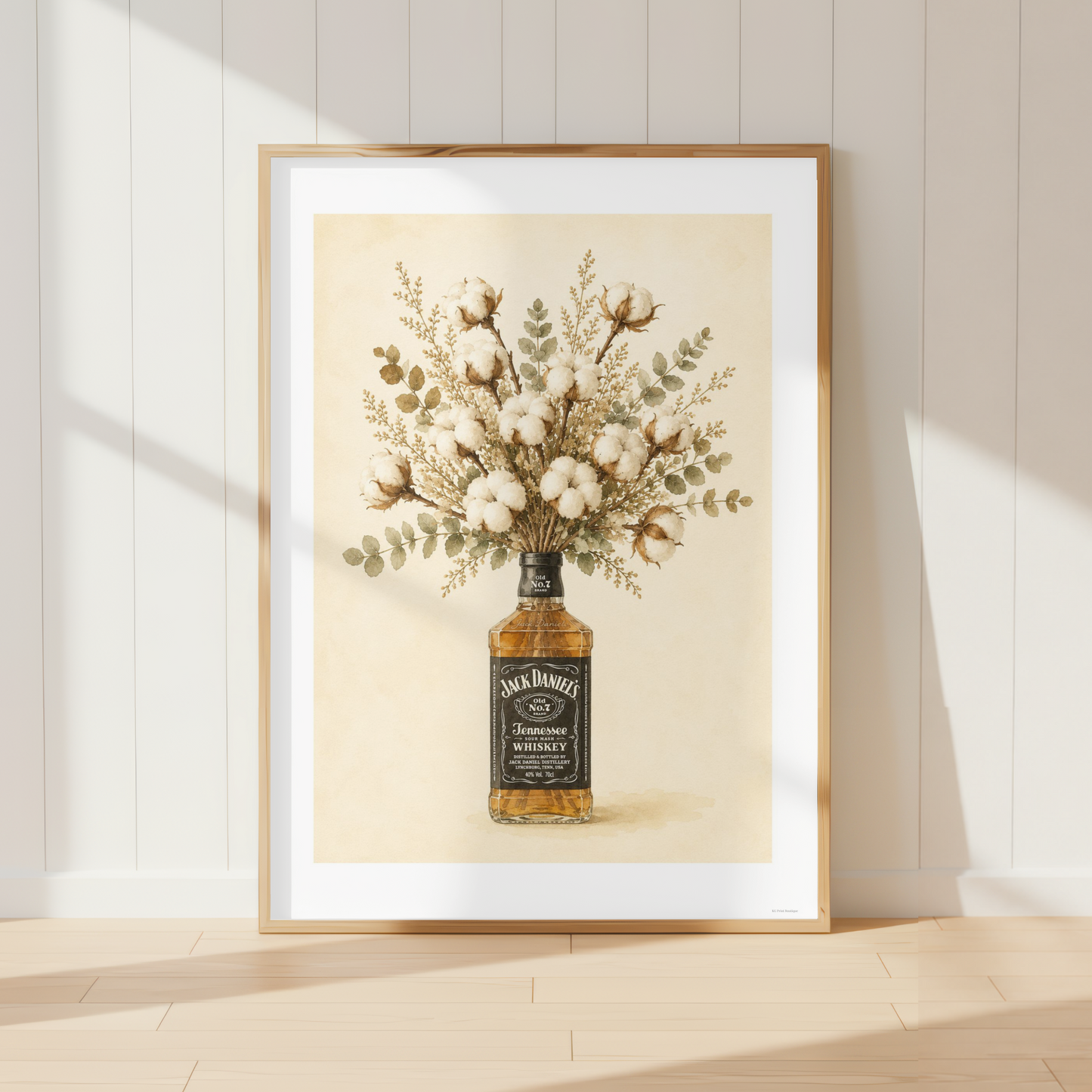 Rustic Jack Daniels wall art featuring a bouquet of soft cotton stems and eucalyptus arranged in a whiskey bottle. Neutral farmhouse botanical print perfect for country kitchens and dining rooms.
