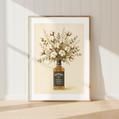 Rustic Jack Daniels wall art featuring a bouquet of soft cotton stems and eucalyptus arranged in a whiskey bottle. Neutral farmhouse botanical print perfect for country kitchens and dining rooms.