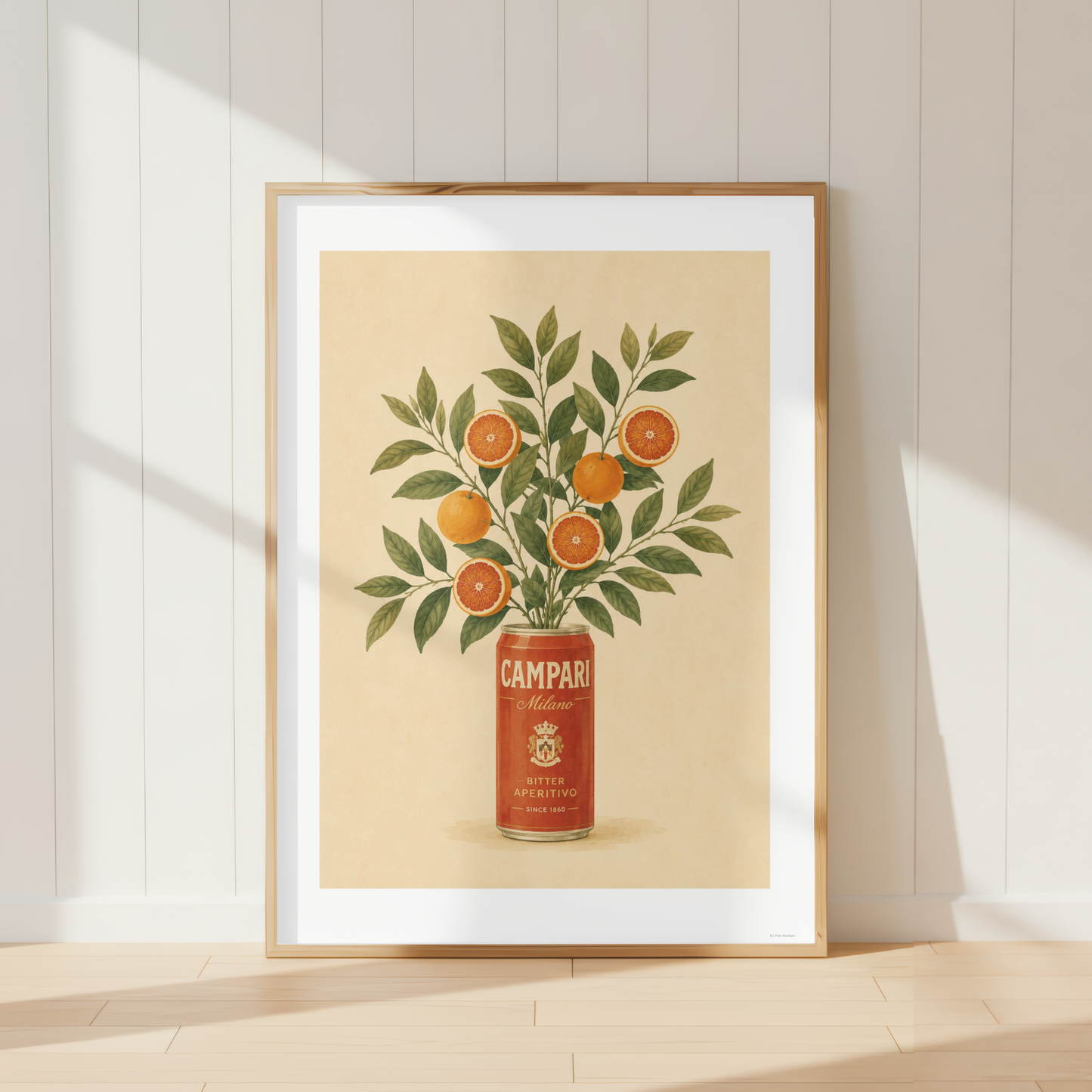 Vintage Campari botanical print featuring oranges and foliage in a Mediterranean kitchen interior.