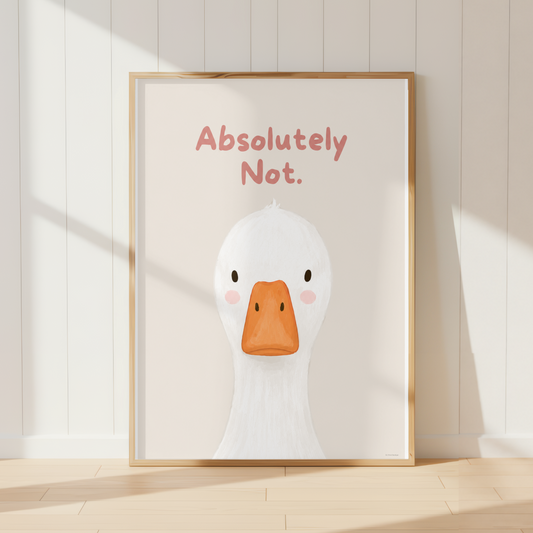 A framed art print featuring a cute white duck illustration with an orange beak and the text 'Absolutely Not.' in pink, leaning against a white paneled wall on a light wood floor.