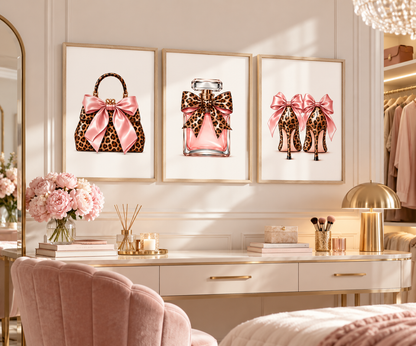 Set of 3 leopard print pink fashion wall art prints featuring handbag perfume and high heels with bows in light oak frames