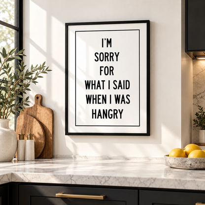 Funny hangry quote kitchen wall art displayed in a bright modern kitchen with black and white typography poster