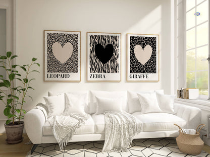 Luxury neutral bedroom featuring contemporary animal print wall art with leopard, zebra and giraffe designs creating a stylish safari-inspired gallery wall.