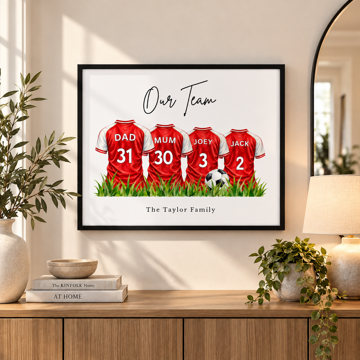 Arsenal inspired personalised family football shirt wall art displayed in modern family living room.