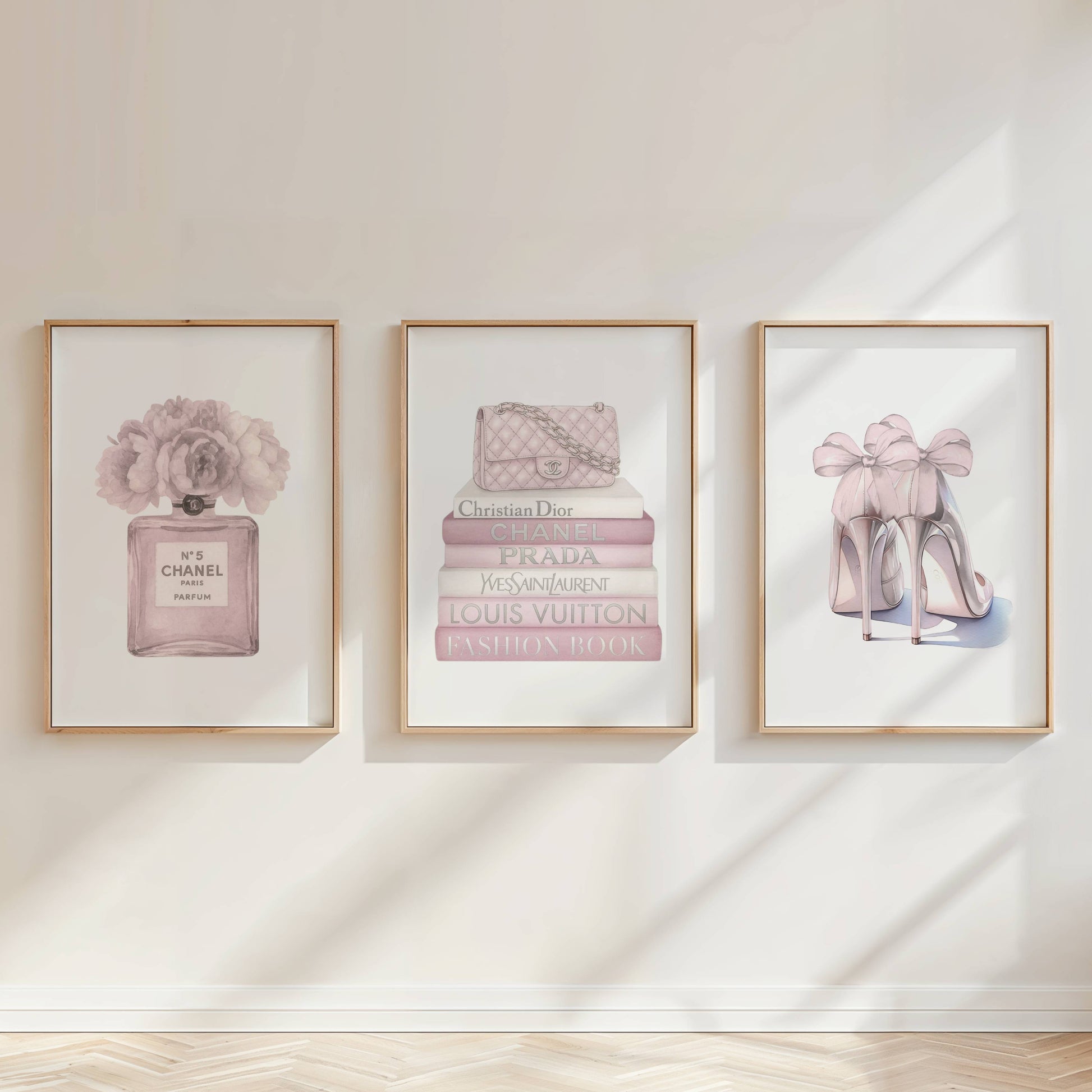 Luxury pink fashion wall art set styled in a feminine glam living room with blush decor
