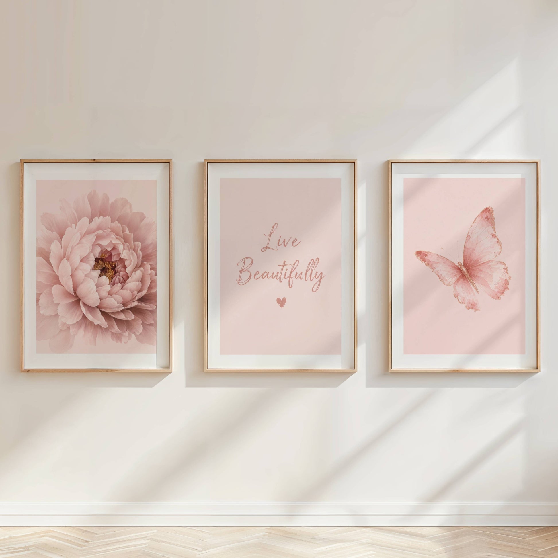 Elegant set of three pink botanical prints featuring peony flower artwork and butterfly wall décor for a feminine bedroom.