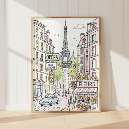 A framed art print depicting a Parisian street scene with the Eiffel Tower, hand-drawn buildings, and storefronts, leaning against a white paneled wall on a light wood floor.