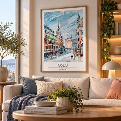A framed art print of Oslo, Norway, featuring a colorful painting of a snowy city street with historic buildings, styled on a beige sofa in a modern living room setting.