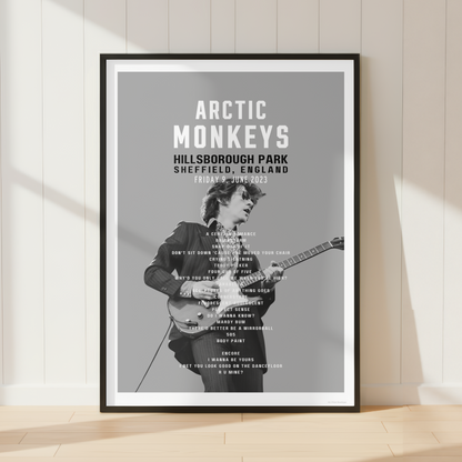 Premium Arctic Monkeys concert poster print showcasing the Hillsborough Park 2023 setlist in a bright contemporary living room with vinyl records and modern interiors.