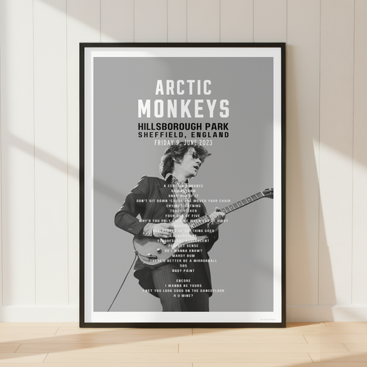Premium Arctic Monkeys concert poster print showcasing the Hillsborough Park 2023 setlist in a bright contemporary living room with vinyl records and modern interiors.