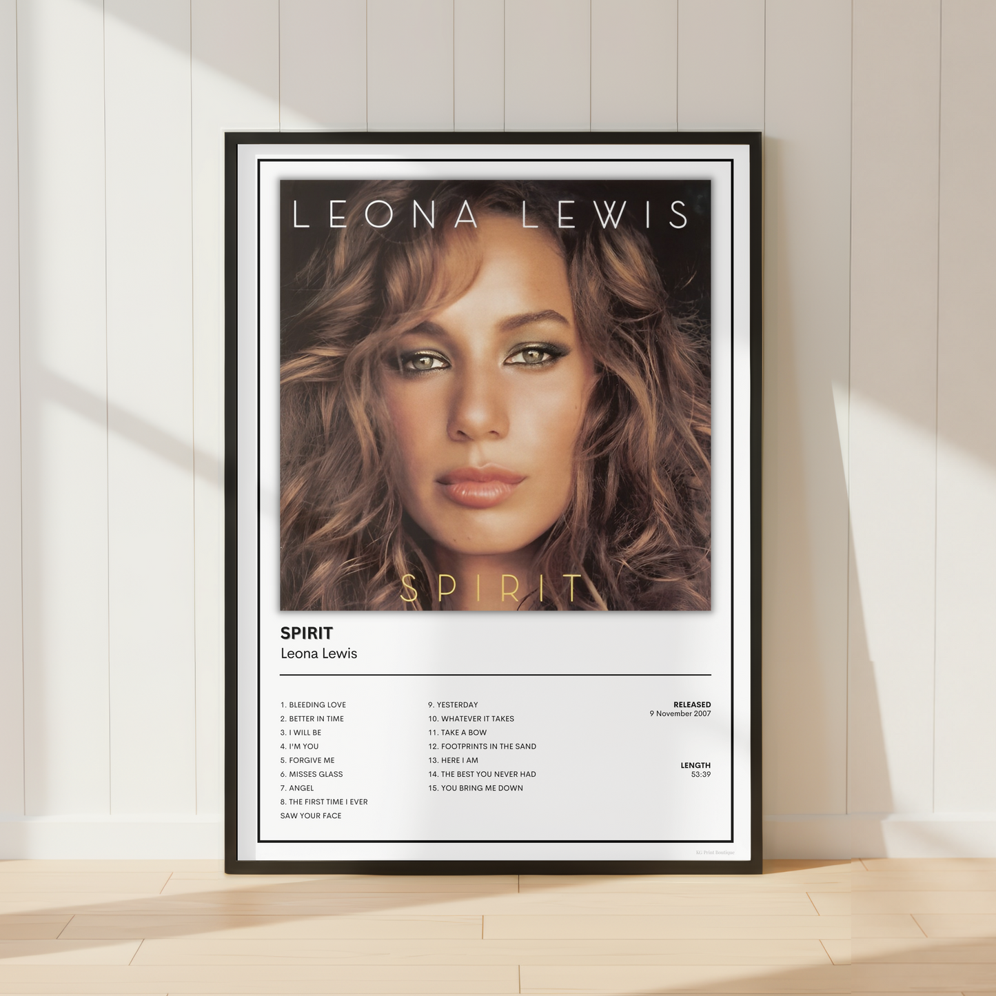 Leona Lewis Spirit album tracklist poster displayed in a bright modern living room with a record player, vinyl collection and contemporary music-inspired décor.