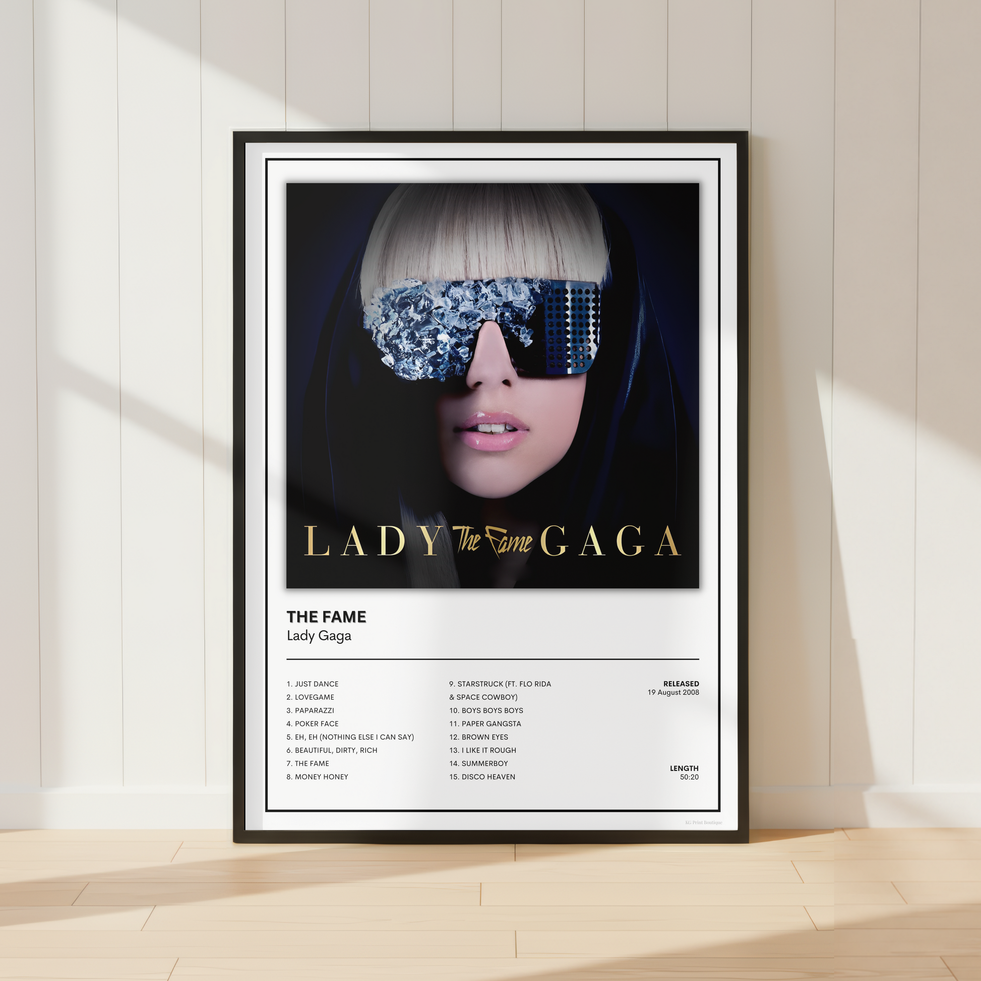 Lady Gaga The Fame album tracklist print in black frame featuring iconic debut album artwork and complete song listing for modern music wall decor.