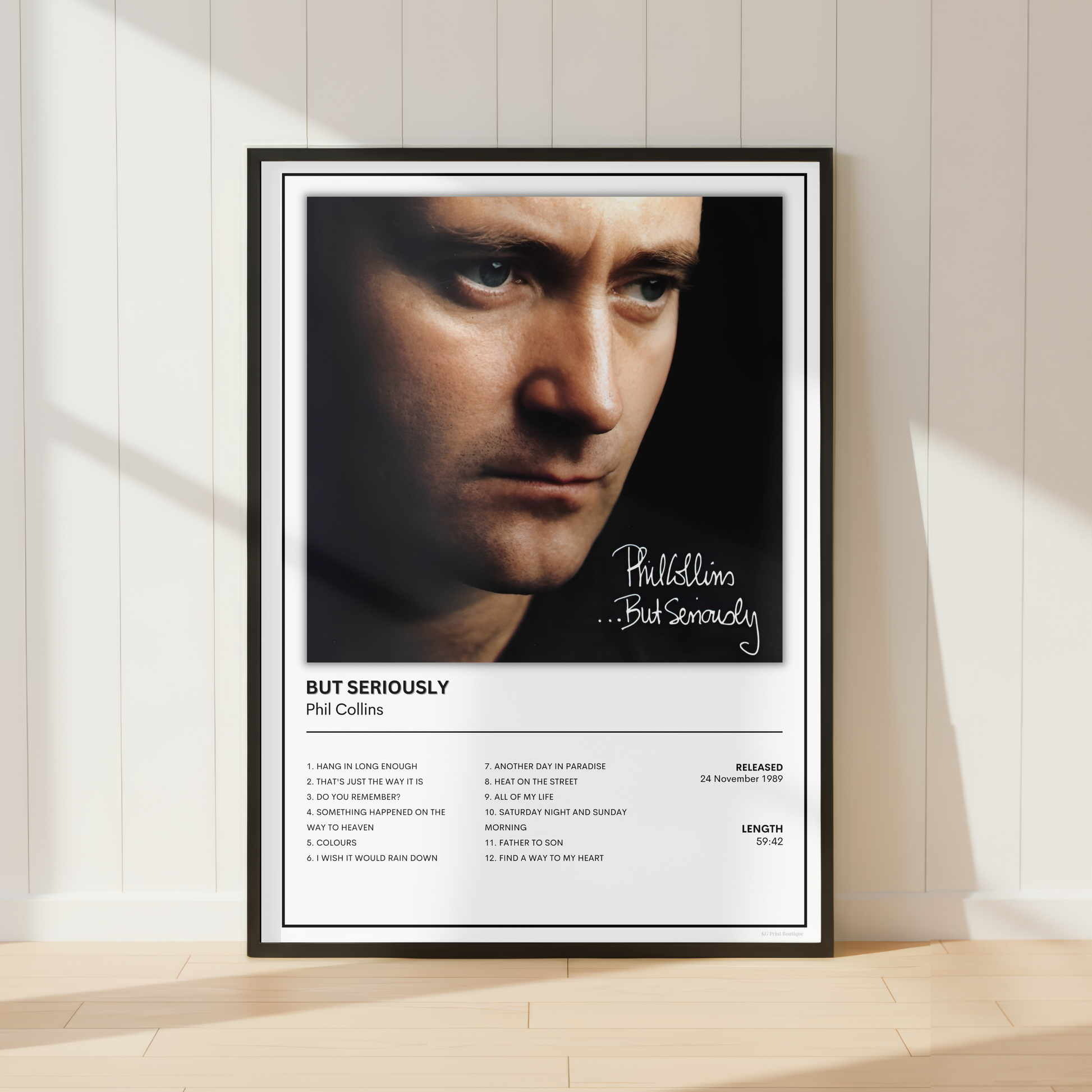 Phil Collins ...But Seriously album cover poster displayed in a sleek black frame, featuring the iconic artwork and complete track listing in a minimalist music print.