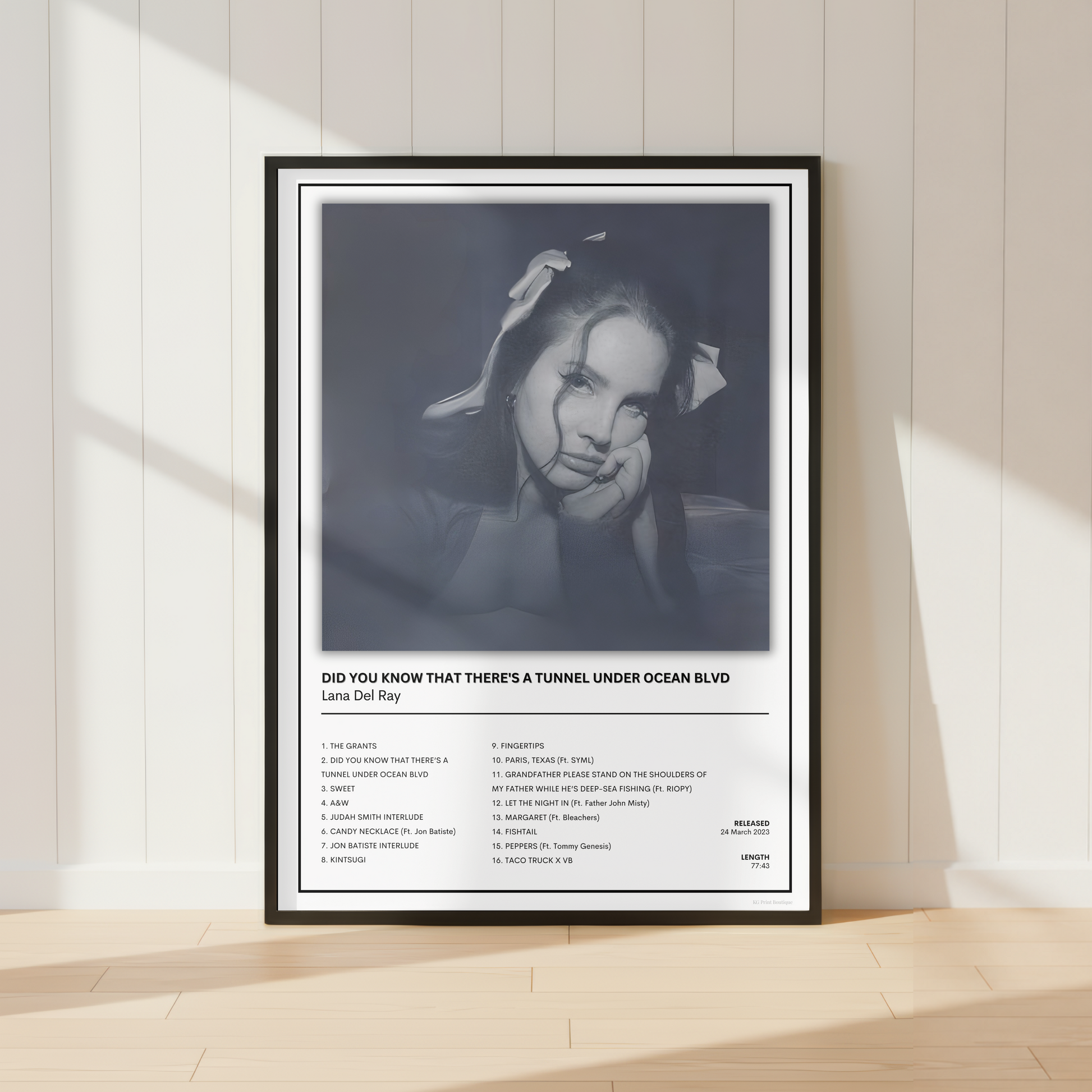 Lana Del Rey Did You Know That There's a Tunnel Under Ocean Blvd album print displayed in a black frame with a white mount.