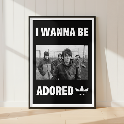 The Stone Roses "I Wanna Be Adored" lyric print displayed in a modern industrial home office with monochrome décor and minimalist styling.