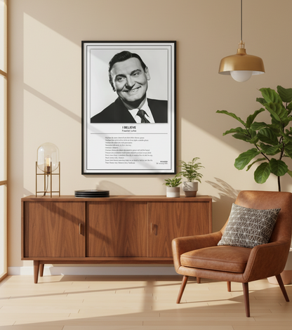 A framed black-and-white poster of Franklie Laine with the text 'I BELIEVE' and a poem printed below, leaning against a white paneled wall on a light wood floor.