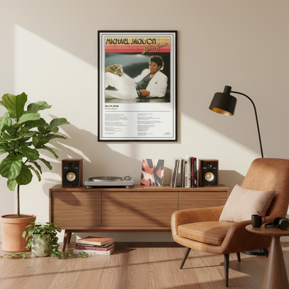 A framed Billie Jean Michael Jackson poster leaning against a white paneled wall on a light wood floor, with soft window shadows cast across the scene.