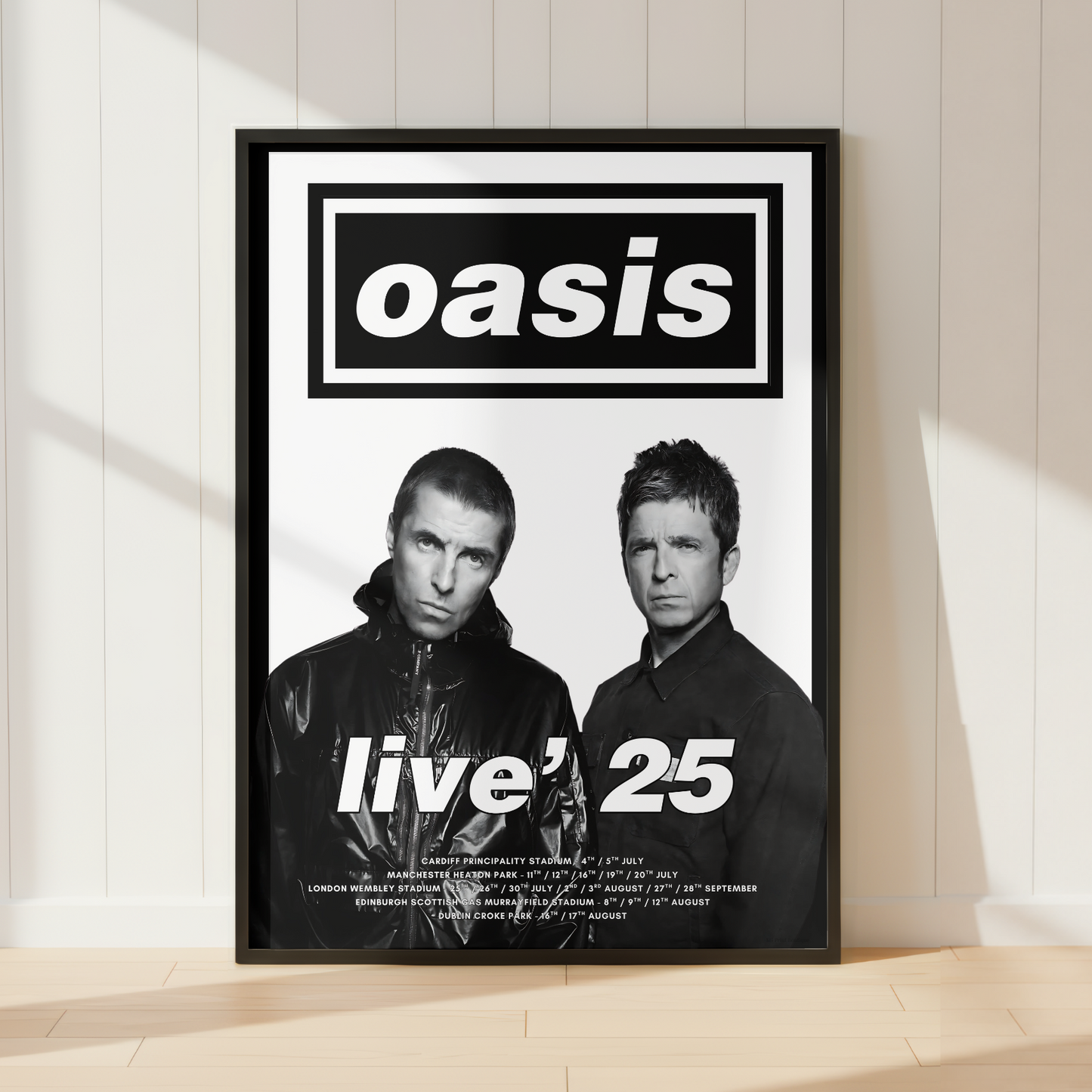 Oasis Live '25 tour poster print in black frame displayed in a modern minimalist living room.