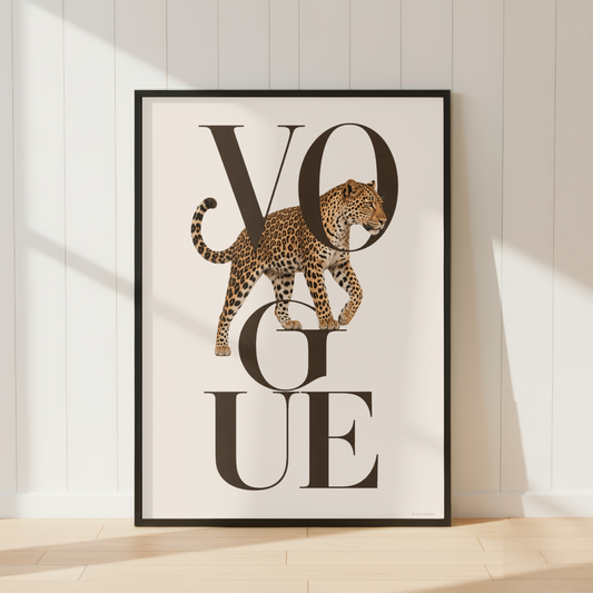 Luxury Vogue leopard wall art featuring elegant black typography and a realistic leopard illustration in warm neutral tones, displayed with a warm ivory mount and black frame.