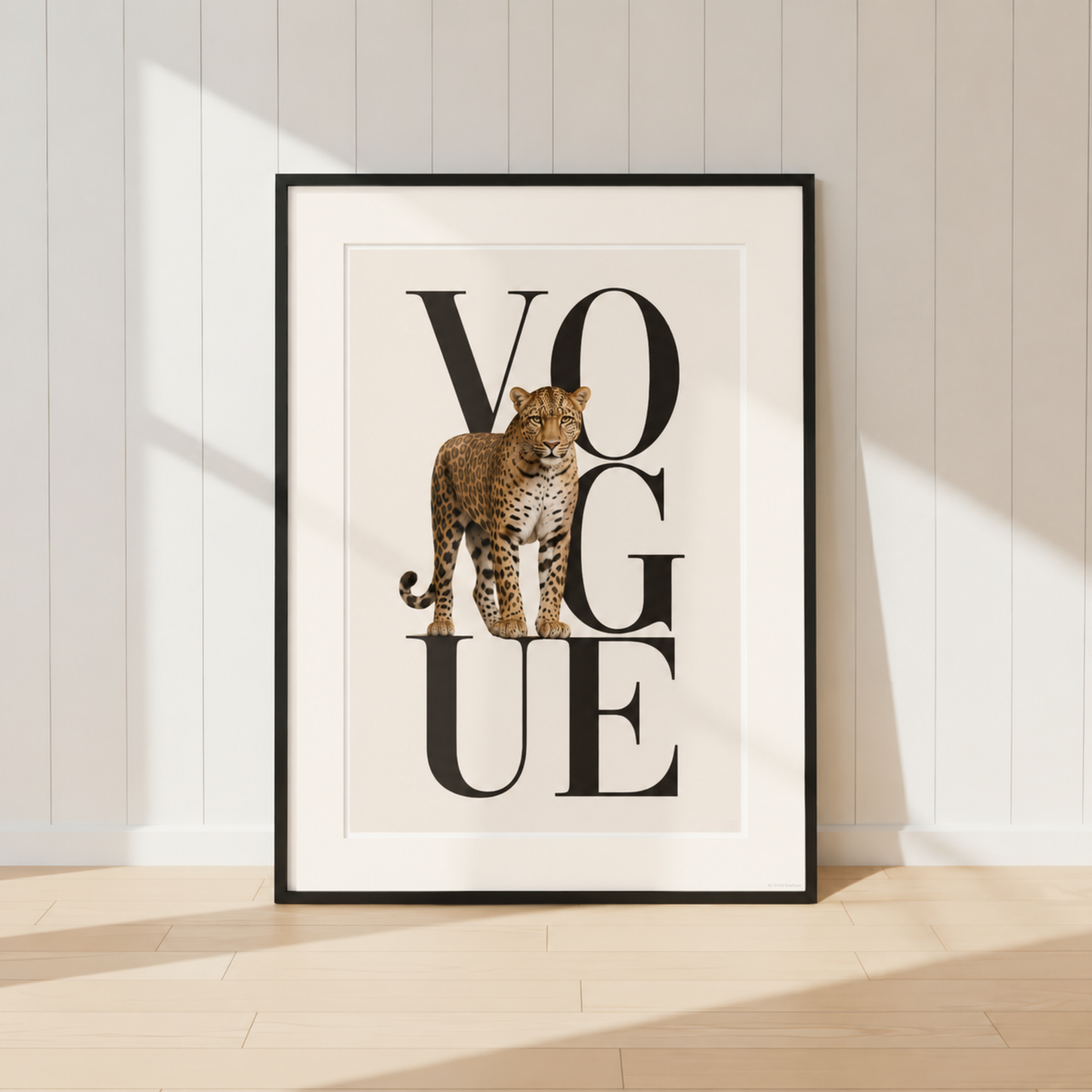 Luxury Vogue leopard print wall art featuring elegant black typography and a realistic leopard illustration in neutral beige tones, displayed in a black frame with a warm ivory mount.